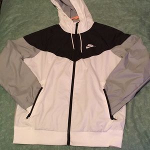 Black, white, and grey Nike windbreaker